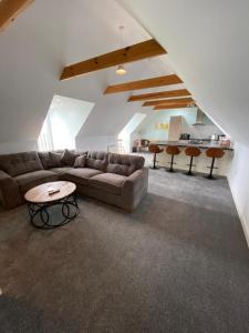 a living room with a couch and a table at Pilgrim Hotel in Hereford