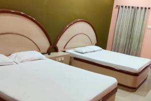 Ένα ή περισσότερα κρεβάτια σε δωμάτιο στο Hotel Paul