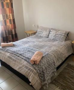 Voodi või voodid majutusasutuse The Corner (Self Catering Accommodation, Windhoek) toas