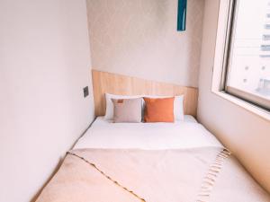Ένα ή περισσότερα κρεβάτια σε δωμάτιο στο R Hotel-The Atelier Shinsaibashi East +61 φωτογραφίες