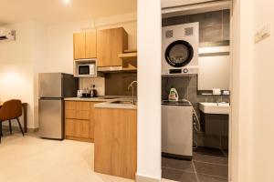 Kuchyň nebo kuchyňský kout v ubytování The Signature Serviced Suites Puchong