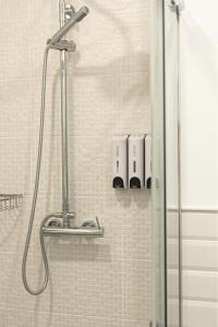 a shower in a bathroom with a glass door at Apartamento Sofia en CALPE in Calpe