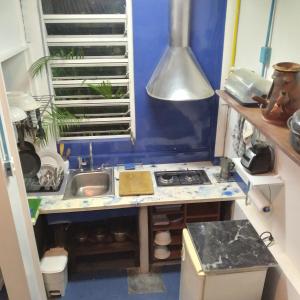 a small kitchen with a sink and a stove at Studio SUITE M&J in Caracas