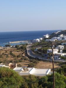 a view of a town with the ocean in the background at Lucas B Panorama in Alopronia