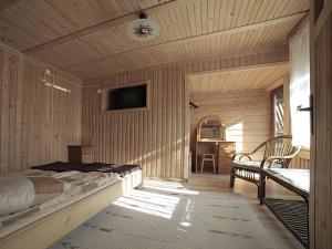 a bedroom with a bed and a desk in it at Pod Strzechą in Białka Tatrzańska
