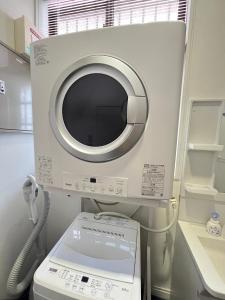 a hospital room with a microwave and a machine at VERY in Naha