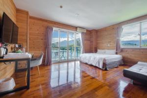 Postel nebo postele na pokoji v ubytování Bishui Shanju Lakeside B&B