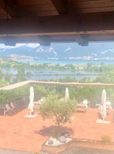 a view of a patio with a view of a lake at Agriturismo Forest B&B in Iseo