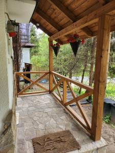 a wooden gate to a patio with a fence at Włudzikówka in Polana