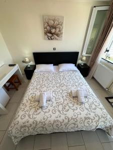 Postel nebo postele na pokoji v ubytování Olia apartment