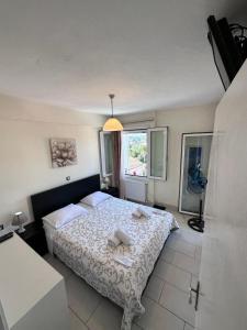 Postel nebo postele na pokoji v ubytování Olia apartment