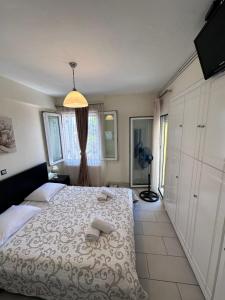 Postel nebo postele na pokoji v ubytování Olia apartment