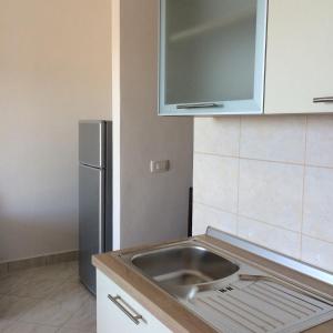 Kuchyň nebo kuchyňský kout v ubytování Apartments Pisac