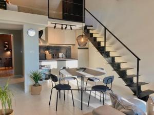 a kitchen and dining room with a table and chairs at The View apartment 2 in Petrovac na Moru