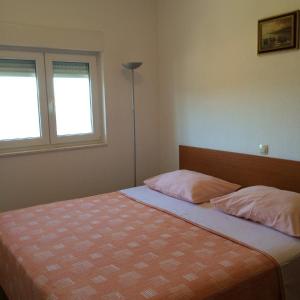 מיטה או מיטות בחדר ב-Apartments Pisac