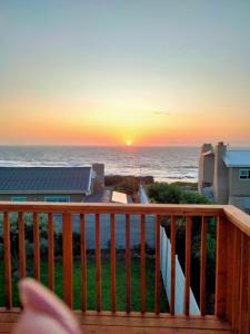 a sunset from the balcony of a condo at Pêrel of Perlemoenbaai in Gansbaai