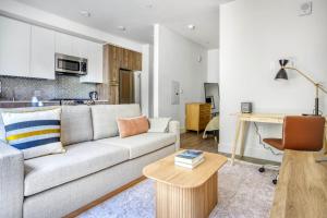 a living room with a couch and a table at Mountain View Studio w Gym WD nr 101 SFO-673 in Los Altos