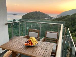 a bowl of fruit on a table on a balcony at The View apartment 2 in Petrovac na Moru