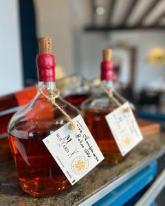 a couple of bottles of honey on a counter at Armes de Champagne in Châlons-en-Champagne