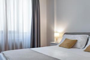 Postel nebo postele na pokoji v ubytování Suite San Biagio