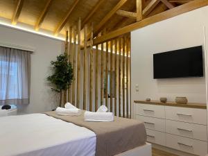 Postel nebo postele na pokoji v ubytování Goninos Jacuzzi Suite