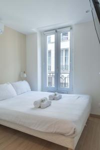 Posteľ alebo postele v izbe v ubytovaní Lavie Maison Parisian Aircon Gem