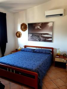 Ένα ή περισσότερα κρεβάτια σε δωμάτιο στο Anna Sunset - Attico con Terrazza vista mare