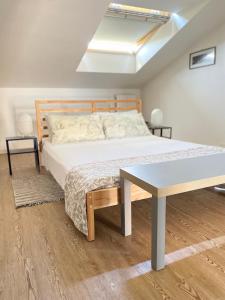 Postel nebo postele na pokoji v ubytování Roof Pellegrini