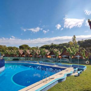 a swimming pool at a resort at Arc de Bará Camping & Bungalows in Roda de Bará