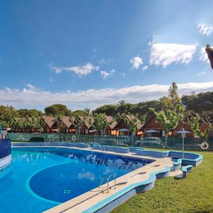 a swimming pool at a resort at Arc de Bará Camping & Bungalows in Roda de Bará