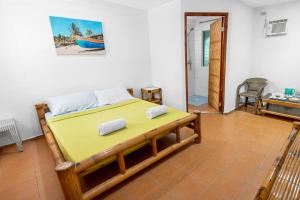 a bedroom with a bed in a room at Panglao Chocolate Hills Resort in Panglao Island