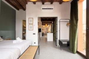 a bedroom with two beds and a hallway at Fabulous One bedroom Apartament in Poble nou in Barcelona