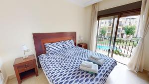 En eller flere senge i et værelse på Darsena RodaGolf-A Murcia Holiday Rentals Property + 25 billeder