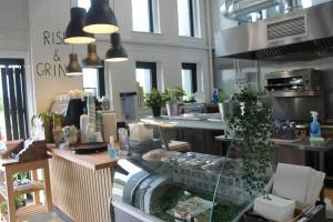 a kitchen with a counter with a glass counter top at Garnock House in Beith