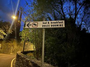 a street sign for the best andbreakiest dogdoothime at DOLCE DORMIRE in Rovereto
