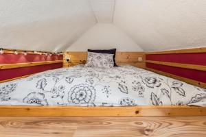 a bedroom with a bed in a small room at Villa Tratea with a heated pool in Tomić Draga
