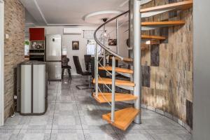 a staircase in a room with a brick wall at Villa Tratea with a heated pool in Tomić Draga +19 photos
