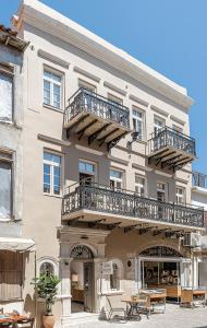 a building with balconies on the side of it at Casa Modiano Boutique in Chania Town