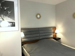Posteľ alebo postele v izbe v ubytovaní Apartment Olymp