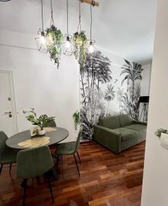 a living room with a table and a couch at Tropical house in Lecce