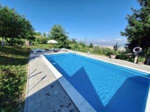 a swimming pool in a yard with at Apartmani Lana in Sarajevo