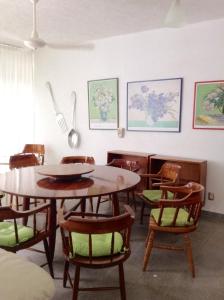 a dining room with a table and chairs at Casa Laguna Magica in Catemaco