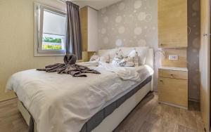 Postel nebo postele na pokoji v ubytování Mobile Home Rojnic