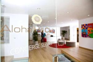 a glass wall in a room with a living room at 5* Serviced Apartment Marbella in Marbella +79 photos