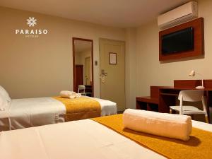 Cama o camas de una habitación en Hoteles Paraiso CHICLAYO