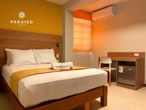 Cama o camas de una habitación en Hoteles Paraiso CHICLAYO