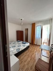 Letto o letti in una camera di My House Kvariati