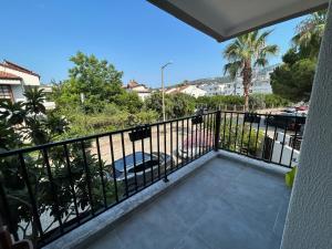 a balcony with a view of a street at Avlu Villas & Apartments in Kemer