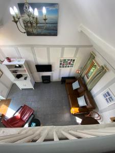 a view of a living room from the top of a room at Barnacle Barn, North Norfolk in Roughton