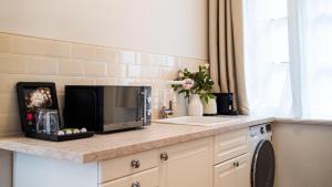 Кухня или мини-кухня в Grâce Boutique Apartments
